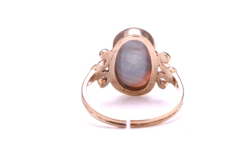 Lot 219 - A precious opal dress ring in 9ct gold,...