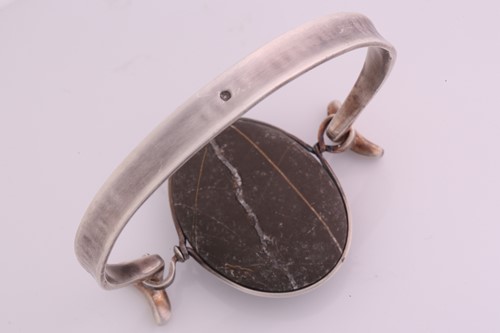 Lot 336 - Torun - 'Arm Ring' with polished rock, a...