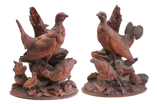 Lot 357 - A pair of Black Forest carved wood figures of...