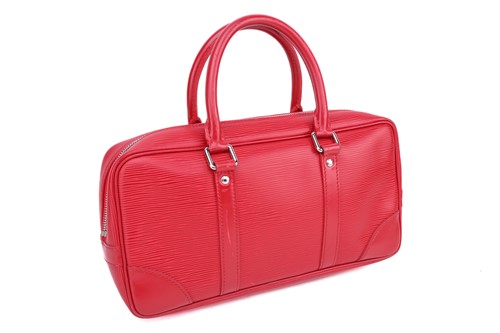 Lot 353 - A Louis Vuitton red epi-leather handbag with...