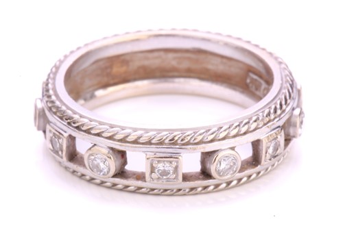 Lot 252 - A diamond-set ring, containing circular-cut...
