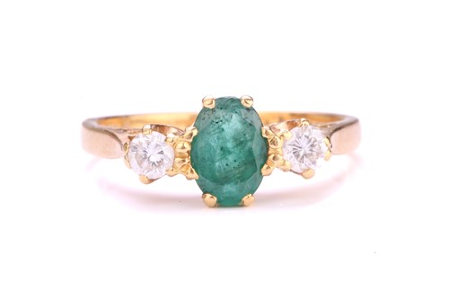 Lot 193 - A three-stone emerald and diamond ring,...