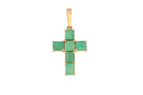 Lot 202 - A cross pendant set with emeralds, comprising...