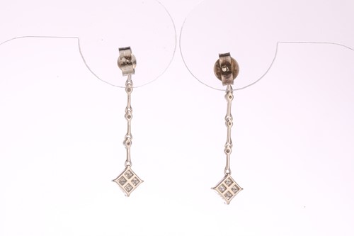 Lot 229 - A pair of diamond drop earrings in 18ct white...