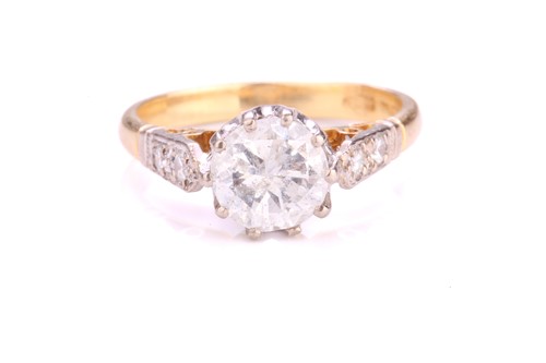 Lot 290 - A diamond solitaire ring in 18ct yellow gold,...