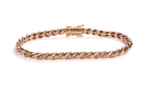 Lot 49 - A diamond-set twisted rope bracelet,...