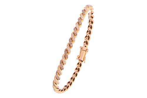 Lot 49 - A diamond-set twisted rope bracelet,...