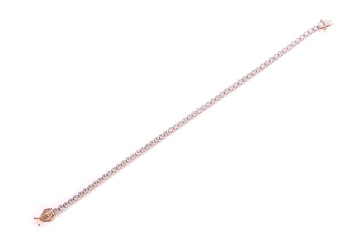 Lot 127 - A diamond line bracelet, comprising an array...
