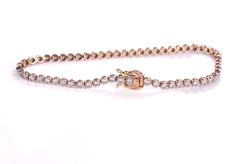 Lot 127 - A diamond line bracelet, comprising an array...