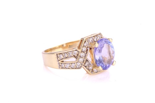 Lot 116 - A tanzanite and diamond dress ring, centrally...