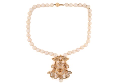 Lot 61 - A pearl necklace with a diamond-set pendant,...
