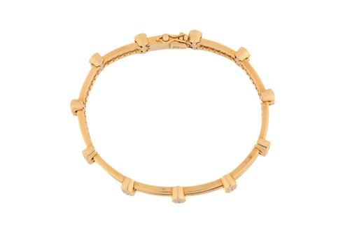 Lot 51 - A diamond-set bracelet, comprising two cords...