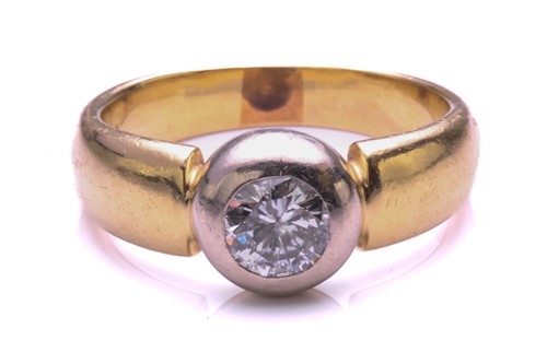 Lot 282 - A single stone diamond ring. The round...