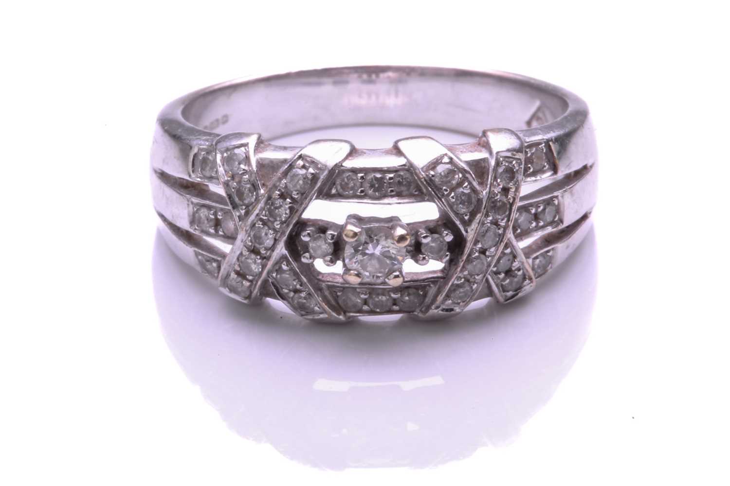 Lot 250 - A 9 carat white gold and diamond ring, the