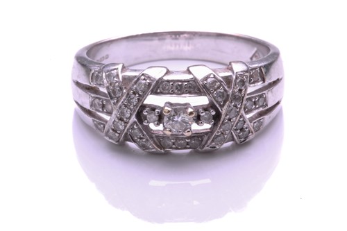 Lot 250 - A 9 carat white gold and diamond ring, the...