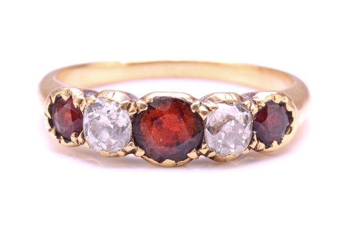 Lot 258 - A Garnet and Diamond five-stone ring, set with...