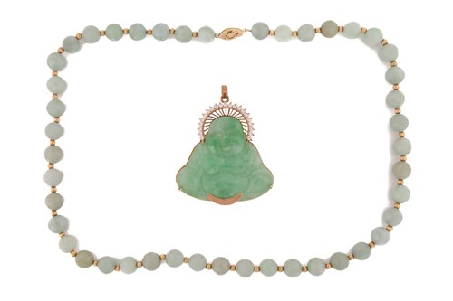 Lot 318 - A jade and diamond pendant in the form of a...