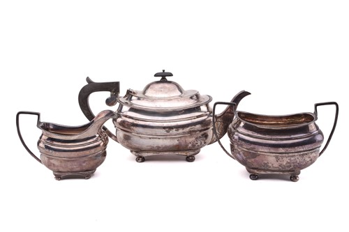 Lot 485 - An early 20th century three piece silver tea...