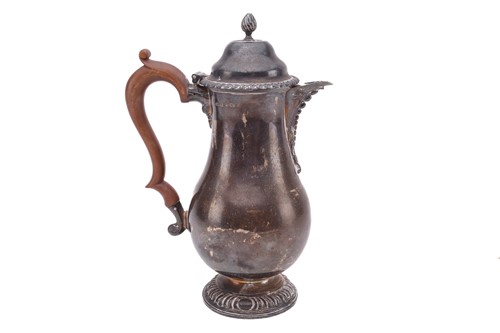 Lot 475 - A silver hot water jug; baluster form with...