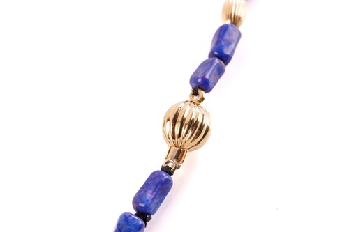 Lot 253 - A lapis lazuli bead necklace, with rectangular...