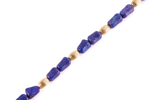 Lot 253 - A lapis lazuli bead necklace, with rectangular...