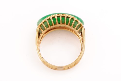 Lot 55 - A Chinese saddle ring set with jadeite and...
