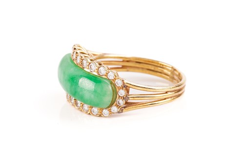 Lot 55 - A Chinese saddle ring set with jadeite and...
