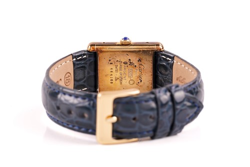 Lot 471 - A Must De Cartier Tank watch, featuring a hand-...