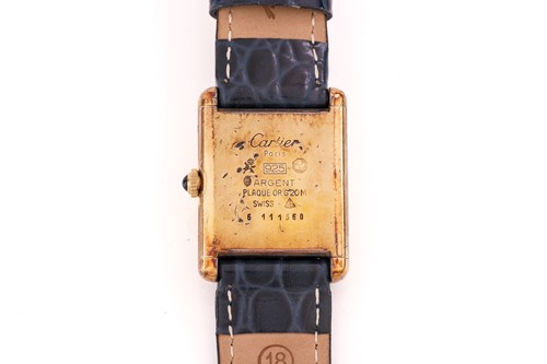 Lot 471 - A Must De Cartier Tank watch, featuring a hand-...