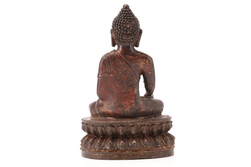 Lot 212 - A patinated and gilt bronze figure of a...