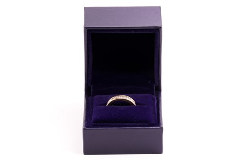 Lot 33 - A diamond half-eternity ring in 18ct yellow...