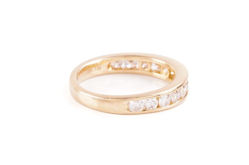 Lot 33 - A diamond half-eternity ring in 18ct yellow...