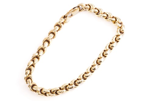 Lot 235 - An Italian fancy link bracelet of curved...