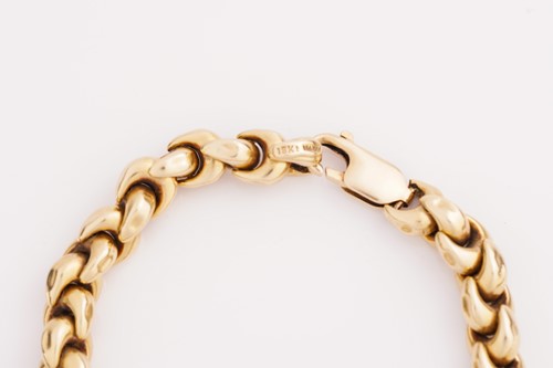 Lot 235 - An Italian fancy link bracelet of curved...