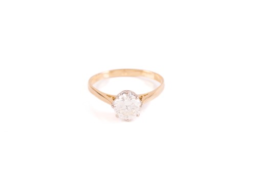 Lot 44 - A single stone diamond ring; the round...