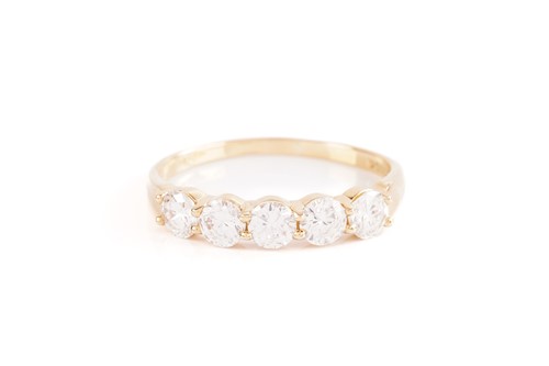 Lot 247 - A five stone diamond half hoop ring; the five...