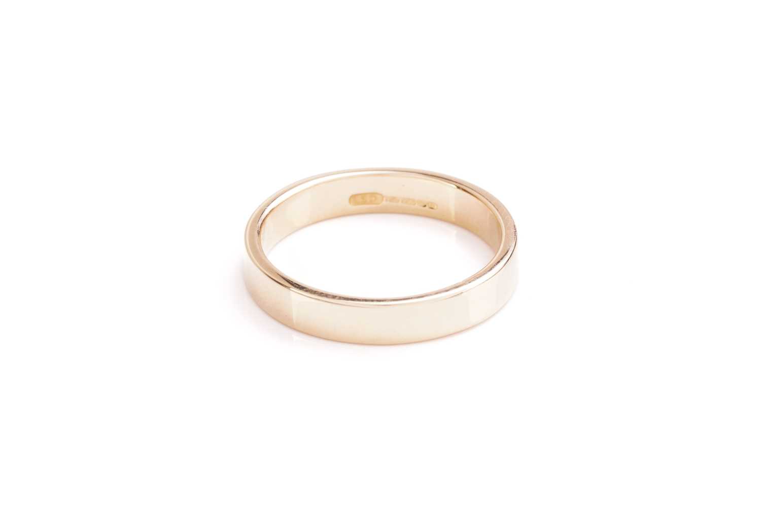 Lot 110 - An 18 carat gold wedding band; plain squared...