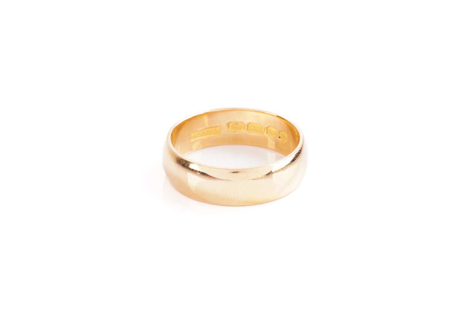 Lot 22 - A plain 22 carat gold wedding band; plain