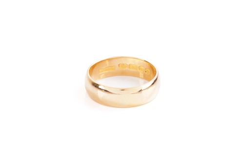 Lot 22 - A plain 22 carat gold wedding band; plain...
