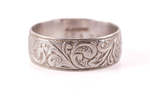 Lot 262 - An engraved wedding band, the D-section band...