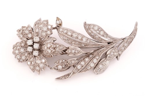 Lot 13 - A flower brooch set with diamonds, the...