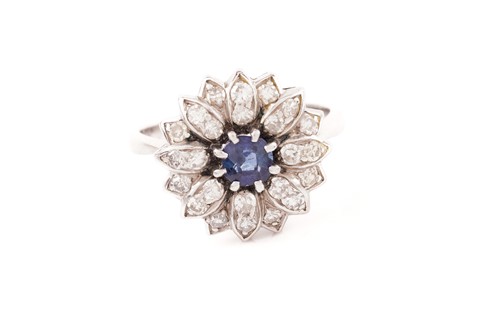 Lot 144 - A diamond and sapphire floral cluster ring,...