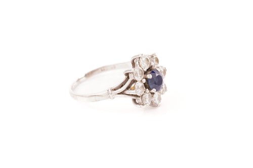Lot 96 - A sapphire and diamond flowerhead ring,...