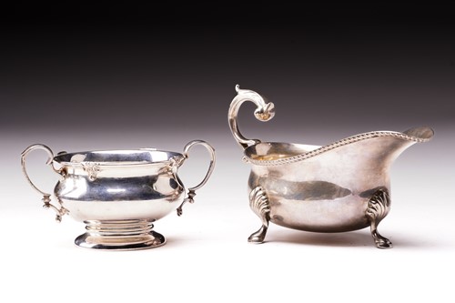 Lot 475 - A silver sauce boat and a silver two handled...