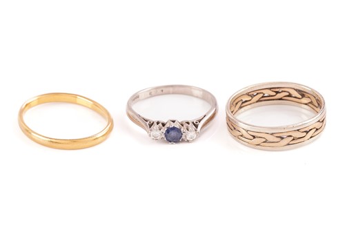 Lot 133 - Three gold rings; including a 22ct yellow gold...