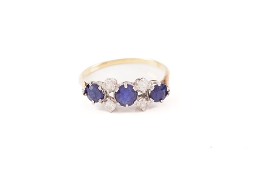 Lot 64 - A sapphire and diamond dress ring, consisting...