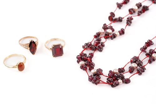 Lot 300 - Three gem-set rings and a bead necklace;...