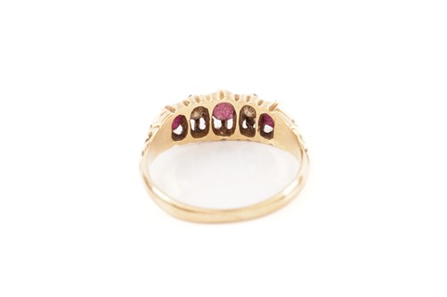 Lot 59 - A five-stone half-hoop ring set with rubies...