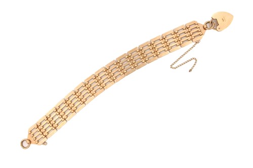 Lot 49 - A 9ct gold gate link bracelet with heart...