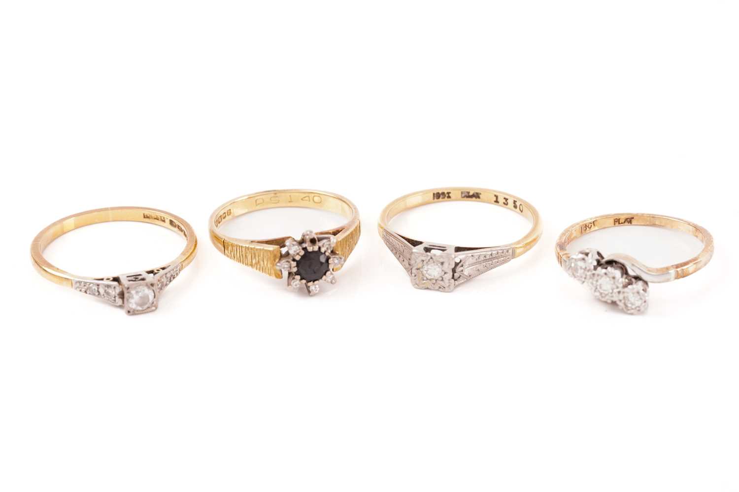 Lot 226 - A ring in 22ct gold together with three other...